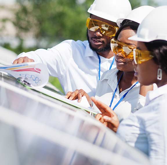 African American technician near solar panels