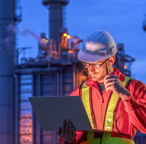 Engineer at oil refinery building in heavy petrochemical industry